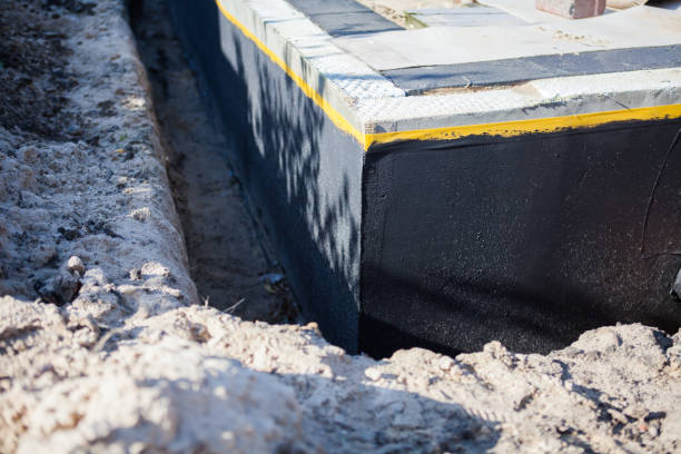 Professional Waterproofing technician working in Newport, MN